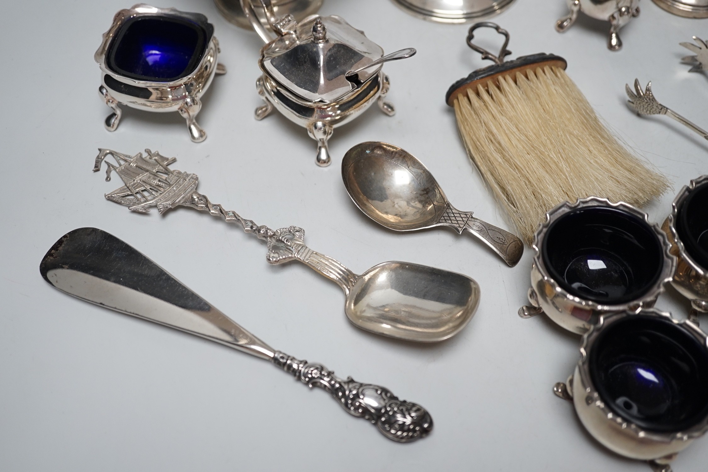Sundry small silver including four salts by Mappin & Webb, three mounted dwarf candlesticks, two white metal Egyptian dishes and a white metal tazza, eight other items including two 19th century caddy spoons and four pla